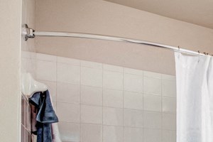 Bathroom with deep soaking tub and granite countertops